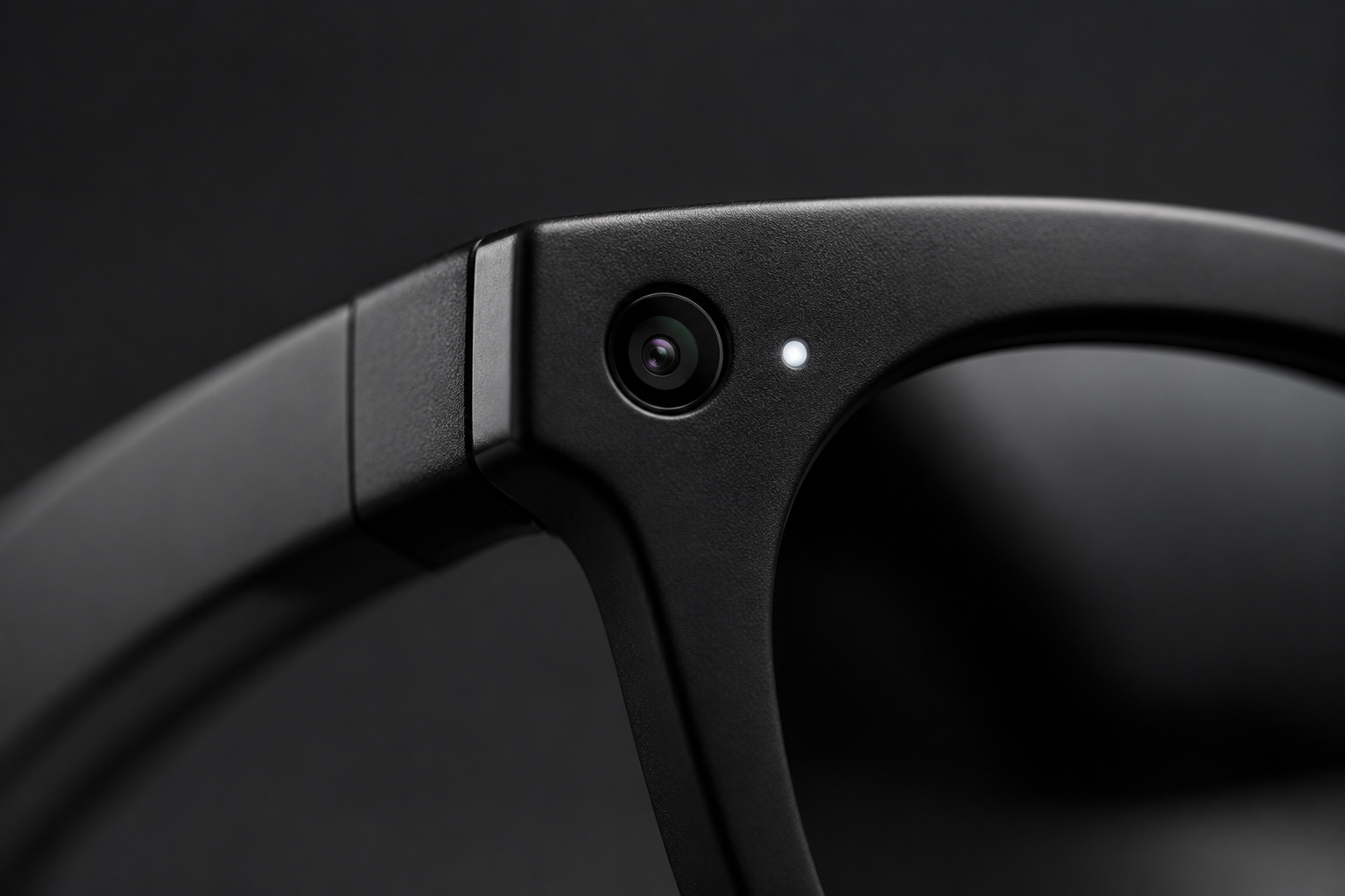 Close-up of the Trace glasses frame showing the camera and the white recording-indicator LED